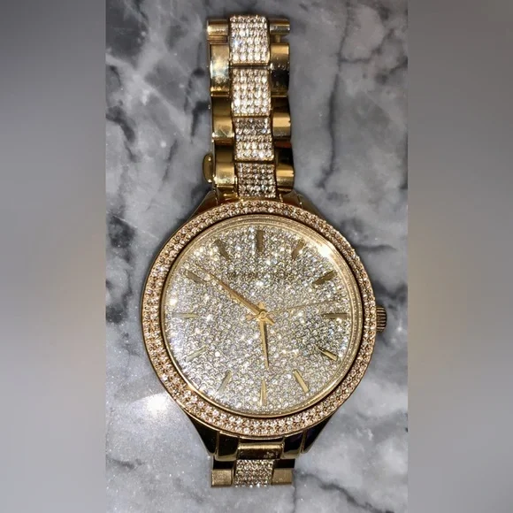 Michael Kors Style #MK3632 Watch
Size: 38mm 
Water Resistance: up to 50 meters Michael Kors Crystal Gold Tone Stainless Steel Ladies Watch  main image 2